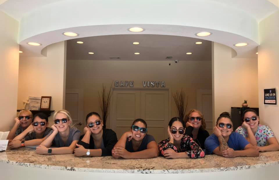 staff at cape vista dental smiling with sunglasses